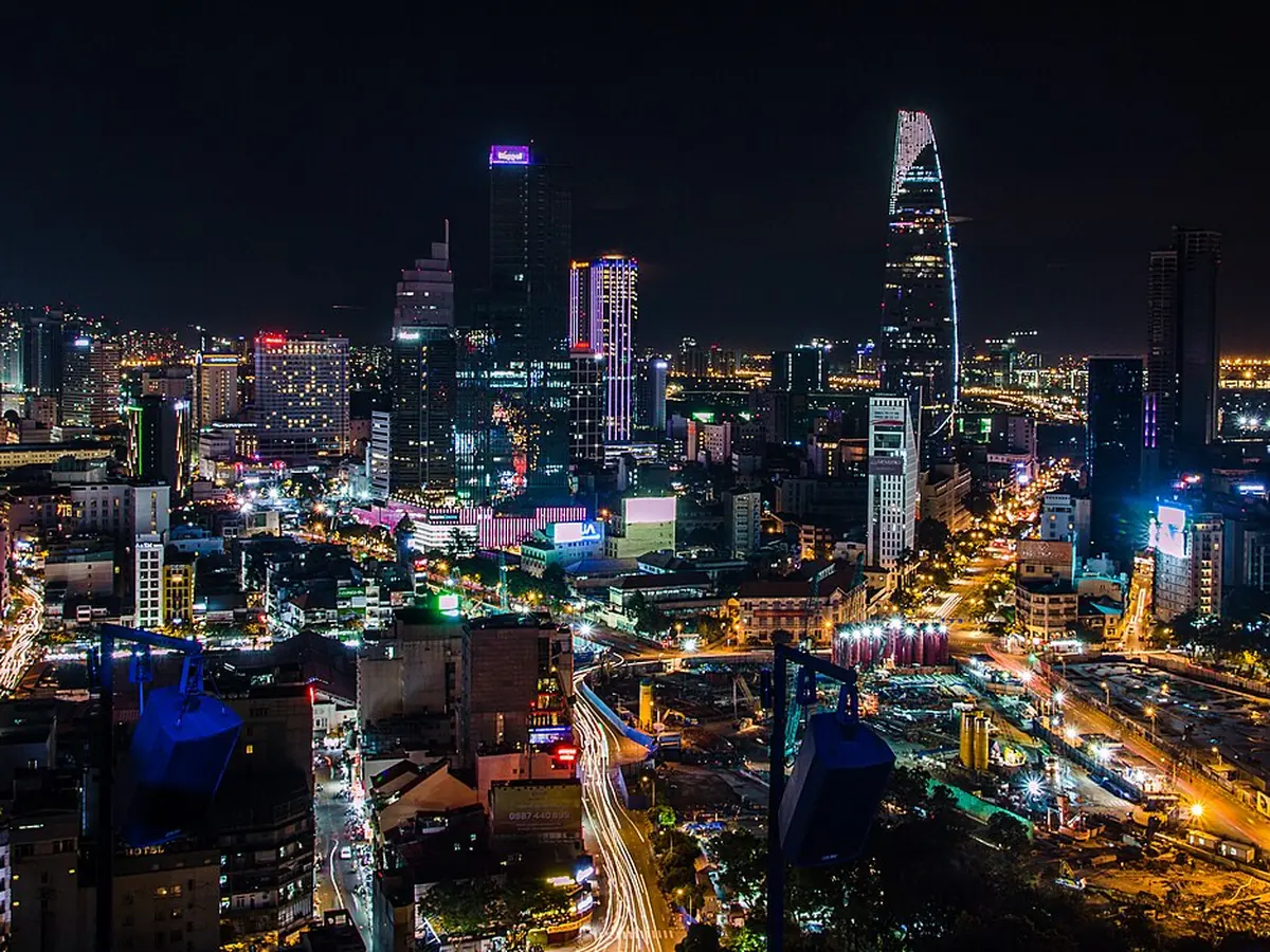 District 1 skyline at night seen from a high floor
